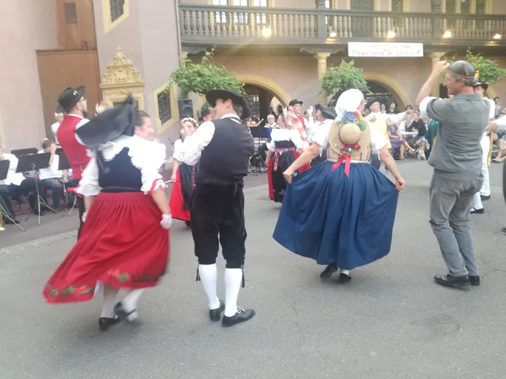 Folklore dancing in the evening at Colmar, Alsace (France)